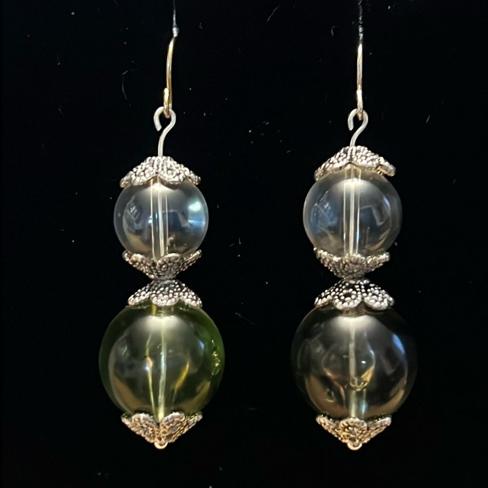 Handcrafted silver tone earrings with clear and green beading